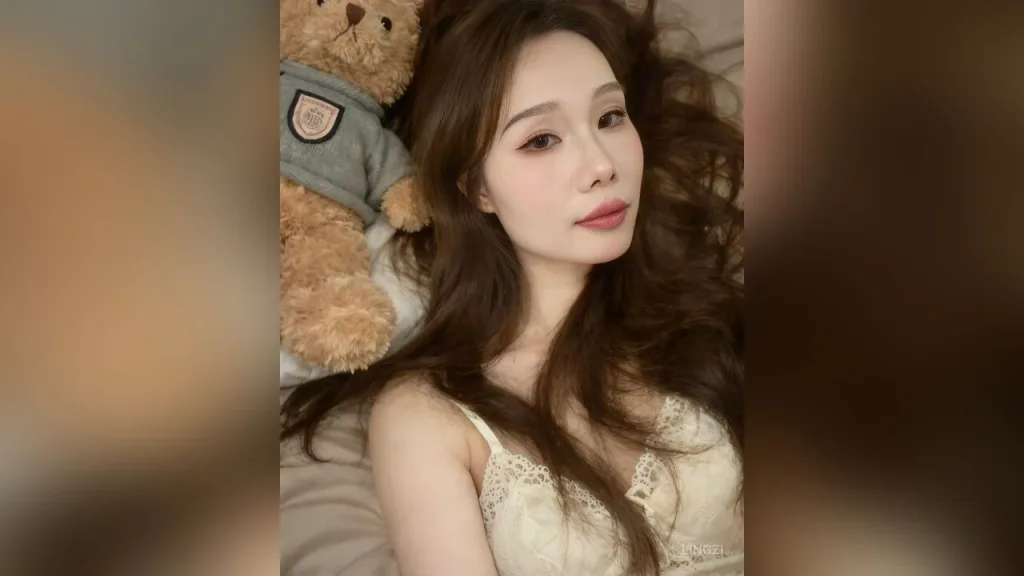 lingzi — lingzi lies on a bed next to a teddy bear wearing a white lace camisole.