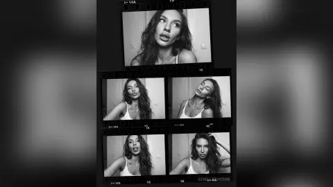 Black and white film strip portrait of a young woman in a white tank top with a moody, cinematic aesthetic.
