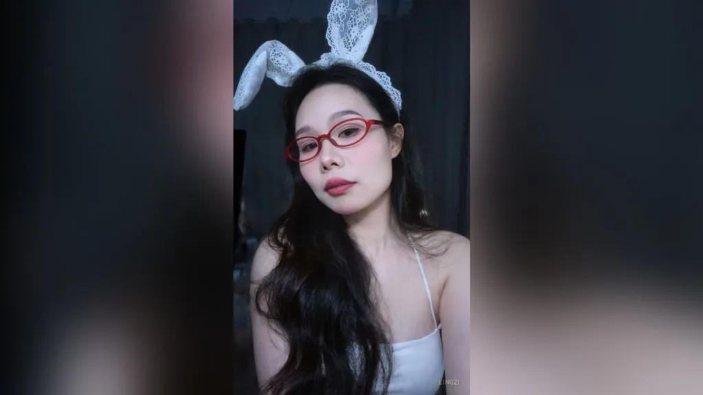 lingzi — lingzi wears red glasses and white lace bunny ears while posing in a white camisole.