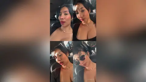 Young woman in a black top and pearl necklace posing for a selfie inside a car with warm lighting.
