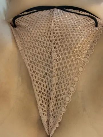 DirtyDaisyLou wears a beige mesh crotchless thong that shows her skin through the lace pattern.