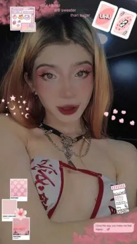 Young woman with blonde hair wearing a red and white patterned bikini top in a dreamy aesthetic setting.