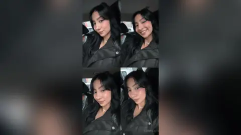 Smiling young woman in a black leather jacket sitting in a car for a moody portrait.