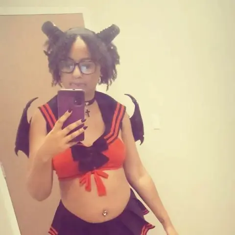 GoddessHoneyXO — GoddessHoneyXO wears a red and black devil costume with horns and wings while taking a mirror selfie.