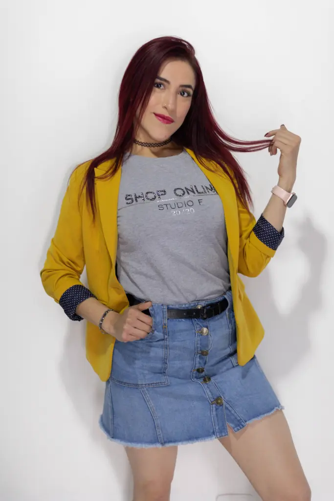 AlissaBrown poses with long red hair, wearing a white sparkly top against a dark circular background.