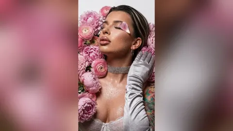 AvaBronX — AvaBronX poses with pink flowers, wearing silver gloves and a sparkly choker with wet skin.