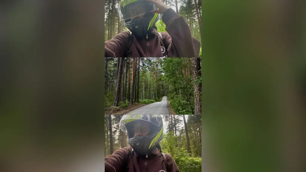SofiMils β SofiMils wears a dark brown hoodie and a black helmet with lime green accents while standing in a dense green forest.
