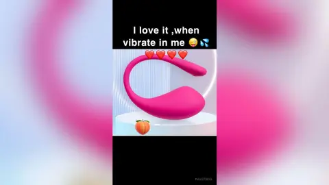 Pink ergonomic wellness device on a white pedestal with a peach icon against a soft pink background.