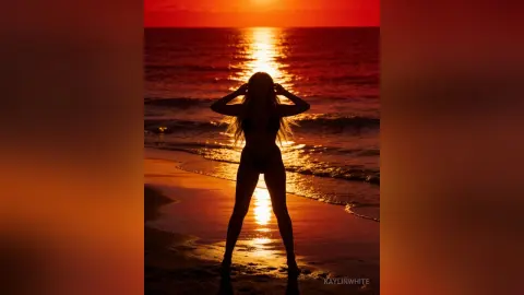 Silhouette of a woman in a bikini standing on a beach during a warm golden sunset over the ocean.
