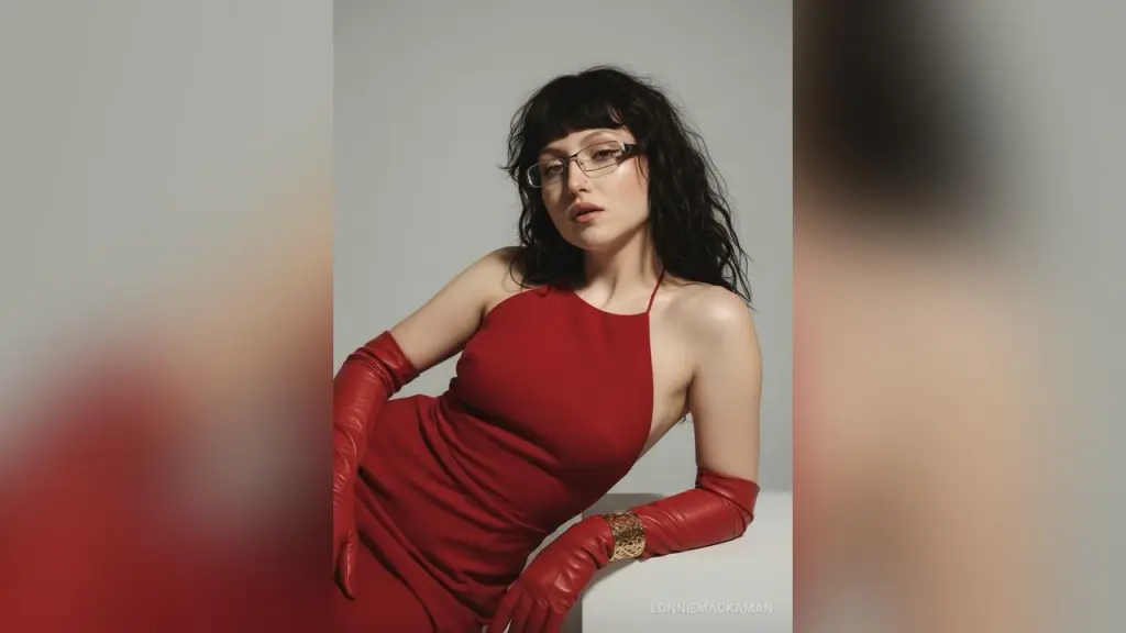 Young woman with dark hair and glasses wearing a light blue beret and pearl necklace in a soft aesthetic mood.
