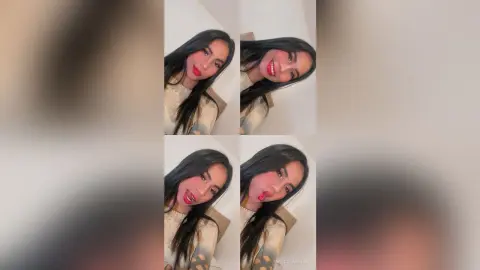 MarcelaMilan smiles and sticks her tongue out at the camera while wearing a beige lace top.