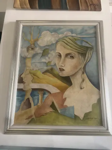 Surrealist oil painting of a woman's face merging with a landscape and tree under a cloudy sky.