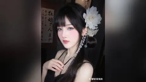 Young woman with long dark hair and white floral hair accessory posing in a moody, dark indoor setting.
