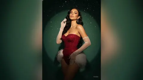 Glamorous woman in a red sequin corset and white gloves posing against a dark starry background.