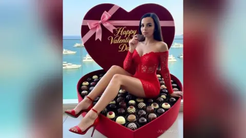 Woman in a red lace dress sitting in a giant heart-shaped chocolate box for a romantic Valentine's Day mood.