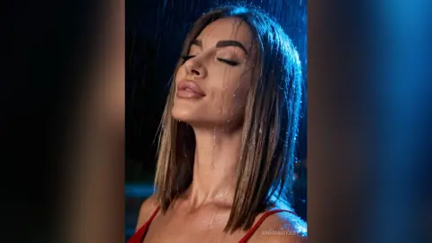 Beautiful woman with wet hair posing under blue night rain in a moody, cinematic atmosphere.