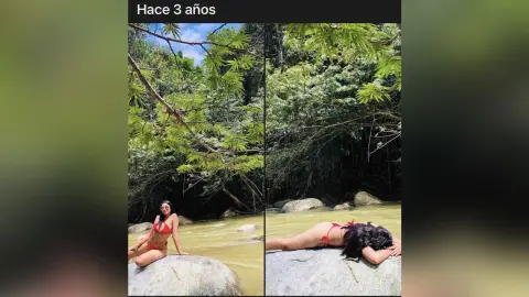 Woman in a red bikini relaxing on a rock by a tropical jungle river in a serene natural setting.