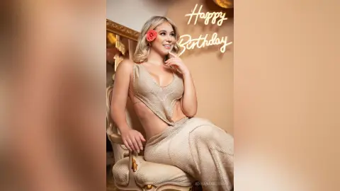 Glamorous woman in a sparkling gold sequin outfit celebrating her birthday in a warm, elegant setting.