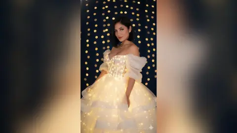 Elegant woman in a glowing LED fairy light wedding dress posing against a sparkling bokeh background.