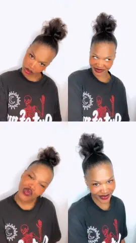 Smiling woman in a black graphic t-shirt with a white skeleton design posing against a white background.