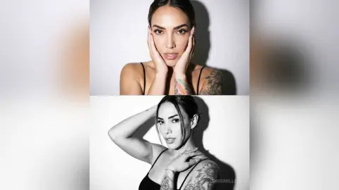 LonisMillers poses with her hands on her face, showing off her dark hair, tattoos, and black camisole strap against a plain white background.