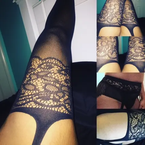 VeraMonae — Close-up of elegant black lace thigh-high stockings and lingerie for a sensual bedroom mood.
