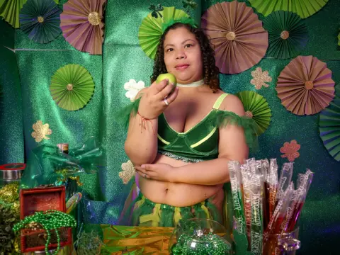 Woman in green festive outfit celebrating St. Patrick's Day with glittery decorations and gold accents.