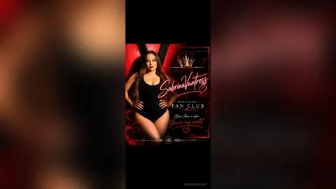 SabrinaVantress poses in a black bodysuit, showing off her long dark hair and curves against a red background.