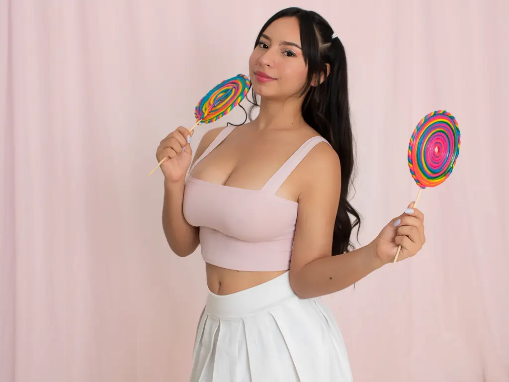 MiaaCastro shows her long dark hair and bare back while sitting in a white bathtub filled with soap bubbles.