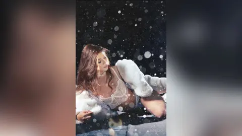 Glamorous woman in white lace lingerie and faux fur coat relaxing in a dreamy, snowy atmosphere.