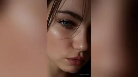 StasyScorpio — StasyScorpio looks into the camera with a close-up gaze and wet hair.