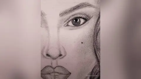Detailed pencil sketch portrait of a woman's face featuring expressive eyes and realistic facial features.