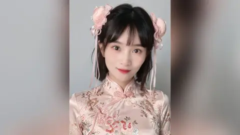 Young woman in a pink floral cheongsam with rose hair accessories posing with a soft, elegant expression.