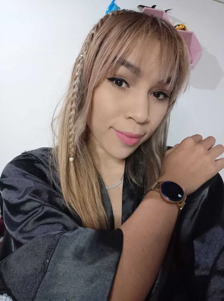 lanna_lee poses with her hand near her mouth, showing her long hair and face in a black and white close-up shot.