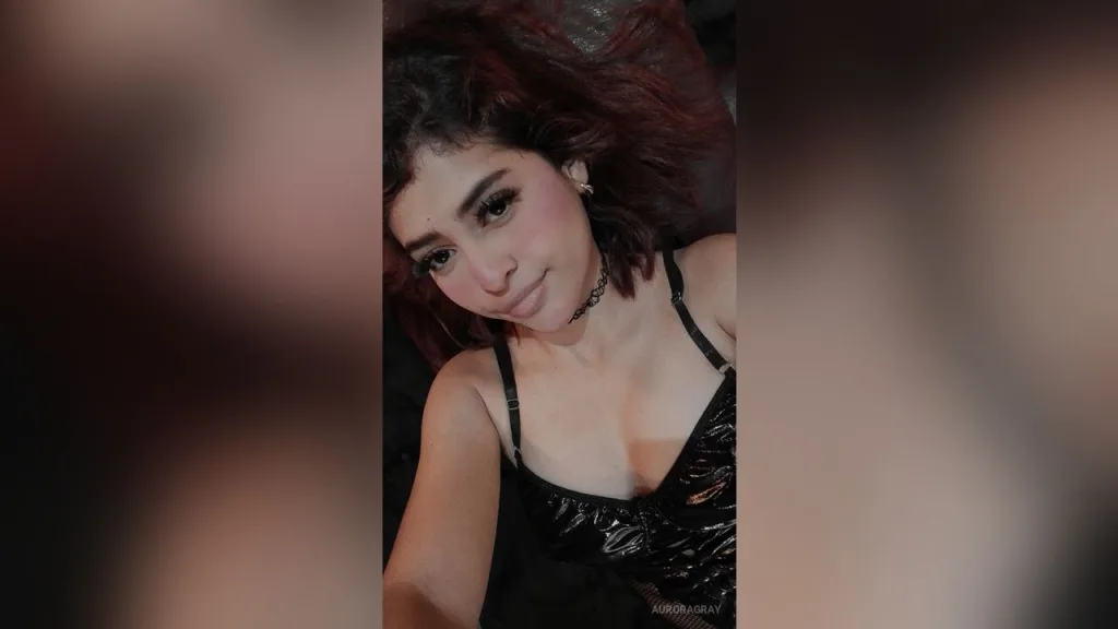 AuroraGray β AuroraGray smiles in a black lace camisole while posing for a selfie.