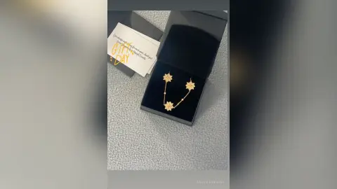 Elegant gold flower pendant necklace displayed in a black gift box for a romantic Mother's Day surprise.