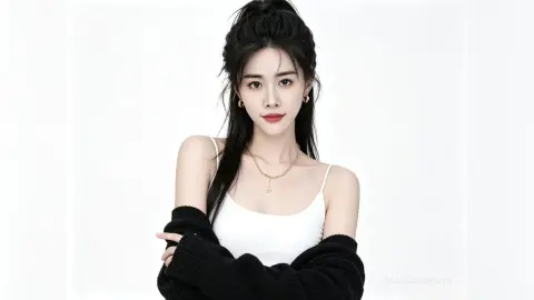 Young woman in a white tank top and black cardigan posing against a clean white background with a serene expression.
