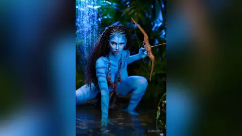 Blue skin female character in tribal jewelry posing in a mystical jungle waterfall setting.