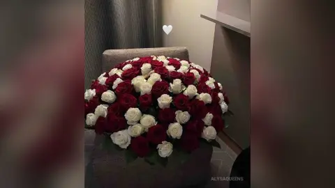 Romantic bouquet of red and white roses in a decorative arrangement for a romantic gift or wedding decor.