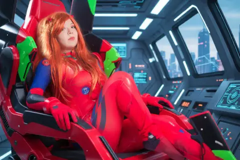Cosplayer in a red superhero bodysuit sitting in a futuristic sci-fi spaceship cockpit overlooking a city.