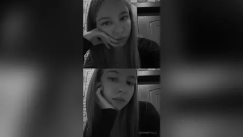 AdenaMcfalls poses with her hand against her cheek, looking at the camera with long straight hair in this black and white photo.