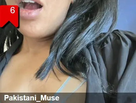 Pakistani_Muse shows her long dark hair and cleavage while wearing a dark purple top.