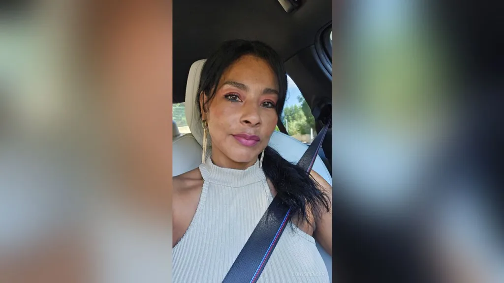 ConySpencer β ConySpencer sits in a car wearing a white ribbed halter top and long gold earrings.