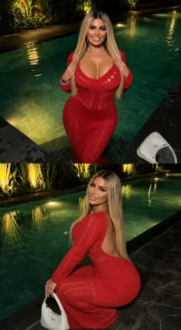Samistaxxx poses in a tight red dress by a glowing swimming pool at night.