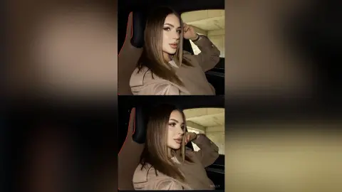 Young woman in a beige sweatshirt posing thoughtfully inside a car with soft natural lighting.