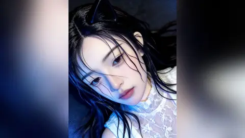 HedyIvy poses with wet black hair and a white lace top against a dark background.