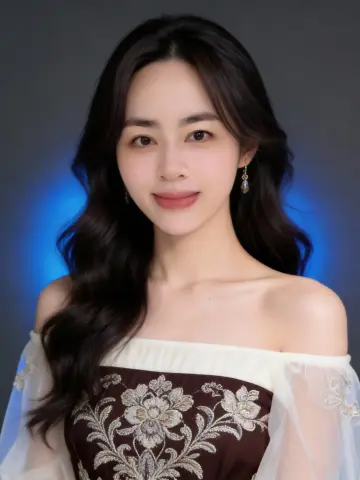 Elegant woman with long wavy hair wearing a floral embroidered off-the-shoulder gown against a blue backdrop.