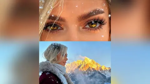 Blonde woman in a cozy fur coat smiling against a snowy mountain landscape at golden hour.