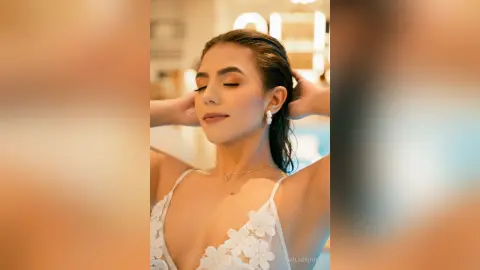 Serene woman in a white lace bikini relaxing by a bright, sunlit swimming pool.