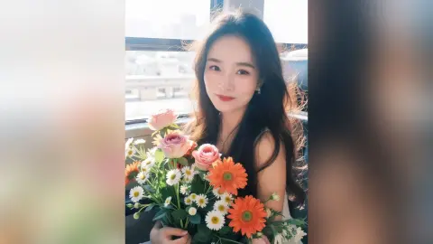 Smiling young woman with long dark hair holding a colorful bouquet of roses and gerbera daisies outdoors.